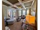 Cozy living room featuring coffered ceiling, ample seating, and seamless entry from the main hall at 842 Treeline Dr, Conyers, GA 30016