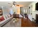 Spacious living room with hardwood floors and seamless view to other main floor rooms at 842 Treeline Dr, Conyers, GA 30016