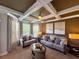 Bright and airy living room with coffered ceiling, neutral decor, and large windows at 842 Treeline Dr, Conyers, GA 30016