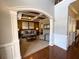 Spacious living room featuring coffered ceiling, ample seating, and seamless entry to the main hall at 842 Treeline Dr, Conyers, GA 30016