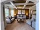 Bright and airy living room with coffered ceiling, neutral decor, and seamless entry from the main hall at 842 Treeline Dr, Conyers, GA 30016