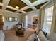 Cozy living room featuring coffered ceiling, ample seating, and natural lighting at 842 Treeline Dr, Conyers, GA 30016