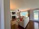 Cozy living room featuring a fireplace, built-in shelves, and comfortable seating at 842 Treeline Dr, Conyers, GA 30016