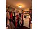 Spacious walk-in closet with custom shelving, ample storage, and organized hanging space at 842 Treeline Dr, Conyers, GA 30016