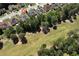 Aerial view of home near the golf course with mature trees and well-maintained properties at 960 River Valley Dr, Dacula, GA 30019