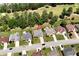 Overhead view of a neighborhood featuring mature trees and well-maintained properties at 960 River Valley Dr, Dacula, GA 30019