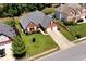 Aerial view of the home showing its well-kept lawn, landscaping, and two car garage at 960 River Valley Dr, Dacula, GA 30019