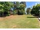 Large, well-maintained backyard, fenced-in perimeter, and mature trees creating a private outdoor space at 960 River Valley Dr, Dacula, GA 30019