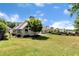 Spacious backyard with lush green grass and mature trees, perfect for outdoor activities at 960 River Valley Dr, Dacula, GA 30019