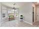 Inviting breakfast nook bathed in natural light, featuring a charming chandelier and plant accents at 960 River Valley Dr, Dacula, GA 30019