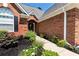 Beautiful front entrance featuring brick facade, decorative plants, and a paved walkway at 960 River Valley Dr, Dacula, GA 30019