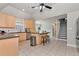 Bright kitchen with stainless steel appliances, wood cabinets, and an island with seating at 960 River Valley Dr, Dacula, GA 30019