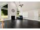 Bright living room featuring high ceilings, a fireplace, and large windows with outdoor views at 960 River Valley Dr, Dacula, GA 30019