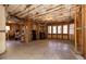 Unfinished basement space with exposed insulation and potential for customization, including laundry hookups at 120 Kettering Trce, Tyrone, GA 30290