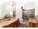 Modern bathroom featuring vanity with granite countertop and glass shower with seat at 120 Kettering Trce, Tyrone, GA 30290