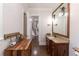 Bathroom with vanity, granite countertop, mirror, and lighting fixtures at 120 Kettering Trce, Tyrone, GA 30290
