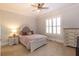 Cozy bedroom with neutral tones, comfortable bed, and natural light at 120 Kettering Trce, Tyrone, GA 30290