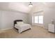 Spacious bedroom with neutral walls, carpeted floors, tray ceiling, and a bright window at 120 Kettering Trce, Tyrone, GA 30290