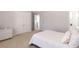 Spacious bedroom with neutral walls, carpeted floors, and adjacent doors at 120 Kettering Trce, Tyrone, GA 30290