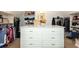 Walk-in closet features island and built-in shelves and hanging rods for ample storage at 120 Kettering Trce, Tyrone, GA 30290