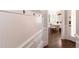 Hallway with wainscoting, coat hooks and dining room in the background at 120 Kettering Trce, Tyrone, GA 30290