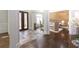Stunning foyer with beautiful hardwood floors, decorative stone accents, and a wood accent wall at 120 Kettering Trce, Tyrone, GA 30290