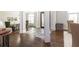 Elegant foyer featuring dark hardwood floors, stone accents, and an ornate front door at 120 Kettering Trce, Tyrone, GA 30290