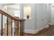 Upstairs hallway nook with hardwood floors and decorative niche at 120 Kettering Trce, Tyrone, GA 30290
