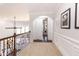 Upstairs hallway with carpet, railing, and wainscoting at 120 Kettering Trce, Tyrone, GA 30290
