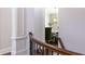Hallway featuring a decorative chandelier and stairway at 120 Kettering Trce, Tyrone, GA 30290