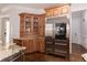 Chef's kitchen with custom cabinets and a professional grade stainless steel refrigerator at 120 Kettering Trce, Tyrone, GA 30290