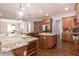 Spacious kitchen boasts custom cabinetry, granite counters, and hardwood floors at 120 Kettering Trce, Tyrone, GA 30290