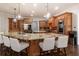 Gourmet kitchen with a large island, granite countertops, and stainless steel appliances at 120 Kettering Trce, Tyrone, GA 30290