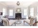 Living room featuring fireplace and lots of natural light at 120 Kettering Trce, Tyrone, GA 30290