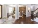 Cozy living room with stylish furniture, wood accent wall, and view of the front entrance at 120 Kettering Trce, Tyrone, GA 30290