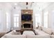 Cozy living room with a stone fireplace and recessed lighting at 120 Kettering Trce, Tyrone, GA 30290
