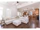 Open-concept living room with hardwood floors and easy access to the kitchen at 120 Kettering Trce, Tyrone, GA 30290