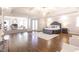 Large main bedroom with hardwood floors, lounge area, fireplace, coffered ceiling, and king bed at 120 Kettering Trce, Tyrone, GA 30290