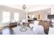 Spacious main bedroom with hardwood floors, large windows, columns, seating areas, and natural light at 120 Kettering Trce, Tyrone, GA 30290