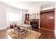 Bright office featuring a fireplace, wooden built-ins, and a cozy sitting area at 120 Kettering Trce, Tyrone, GA 30290