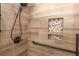 Beautifully tiled shower with rainfall shower head and built-in niche at 120 Kettering Trce, Tyrone, GA 30290