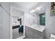 Bright bathroom featuring a double vanity, recessed lighting, and stylish tiled shower at 1482 Andrews Nw St, Atlanta, GA 30314
