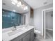 Bathroom featuring a double vanity, modern lighting, and stylish tiled shower at 1482 Andrews Nw St, Atlanta, GA 30314