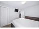 Bright bedroom features clean white bedding, TV, and minimalist style, offering a tranquil and comfortable personal space at 1482 Andrews Nw St, Atlanta, GA 30314
