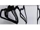 Walk in closet with storage shelf with a wire rack and multiple dark colored hangers at 1482 Andrews Nw St, Atlanta, GA 30314