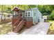 Charming blue home with a cozy front porch and wooden stairs leading to the entrance at 1482 Andrews Nw St, Atlanta, GA 30314