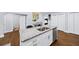 Bright kitchen with granite counters, stainless steel appliances, and sleek white cabinets at 1482 Andrews Nw St, Atlanta, GA 30314