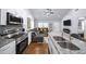 Modern kitchen with granite counters, stainless steel appliances, and gray backsplash at 1482 Andrews Nw St, Atlanta, GA 30314