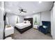 Spacious main bedroom featuring a ceiling fan, plush carpet, and bright, natural light at 1482 Andrews Nw St, Atlanta, GA 30314
