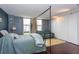 Bedroom featuring a bed with a metal frame, city views, and an adjacent seating area at 375 Ralph Mcgill Ne Blvd # 1701, Atlanta, GA 30312